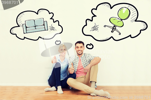 Image of happy couple showing thumbs up at new home