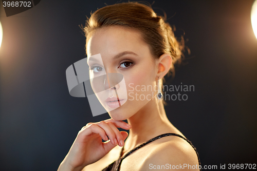 Image of beautiful young asian woman with diamond earring