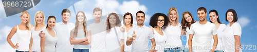 Image of group of happy different people in white t-shirts