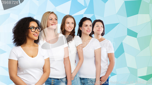 Image of group of happy different women in white t-shirts