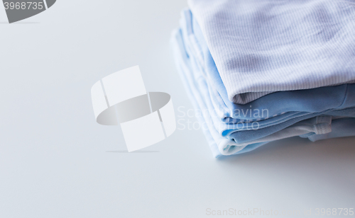 Image of close up of baby boys clothes for newborn on table