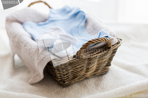 Image of close up of baby clothes for newborn boy in basket