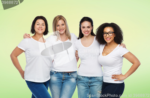 Image of group of happy different women in white t-shirts