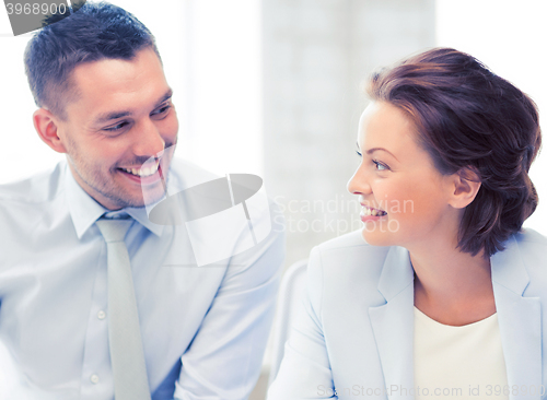 Image of business team discussing something in office