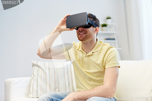Image of young man in virtual reality headset or 3d glasses