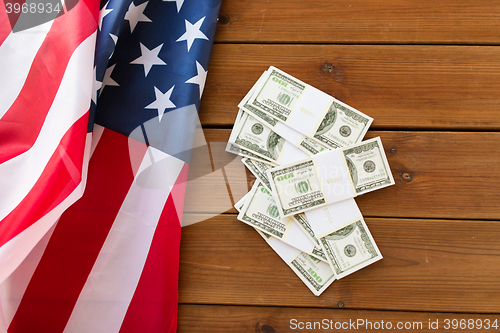 Image of close up of american flag and dollar cash money