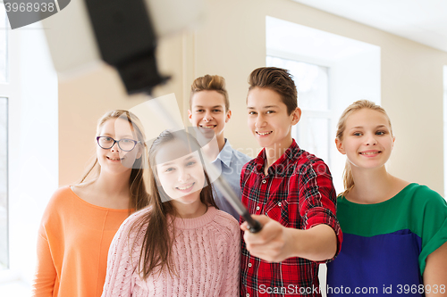 Image of group of students taking selfie with smartphone