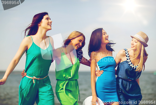 Image of girls walking on the beach