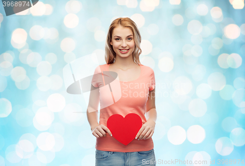 Image of happy woman or teen girl with red heart shape