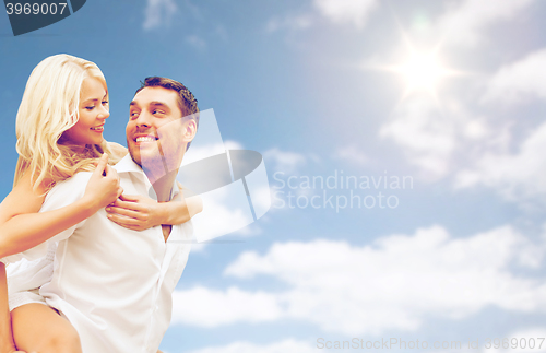 Image of happy couple having fun over blue sky background