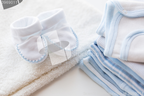 Image of close up of baby boys clothes for newborn on table