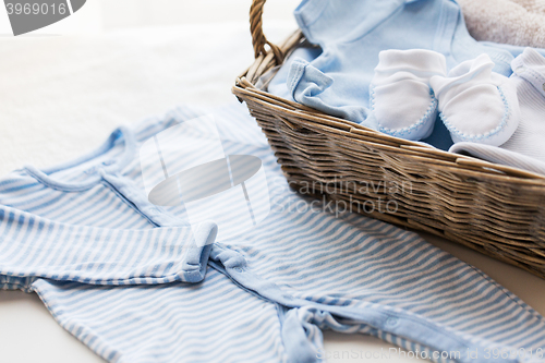 Image of close up of baby clothes for newborn boy in basket