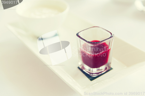 Image of close up of yogurt and jam at restaurant