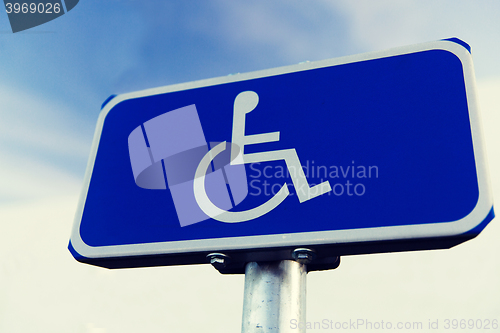 Image of close up of road sign for disabled outdoors