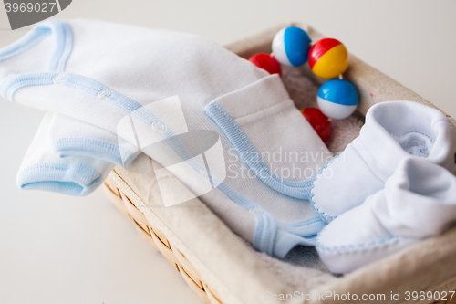 Image of close up of baby clothes for newborn boy in basket