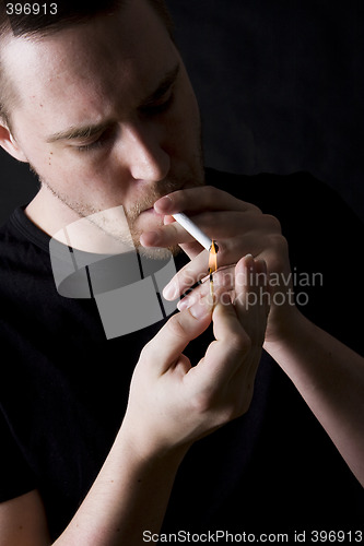 Image of man smoking a cigarette