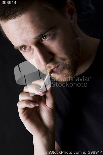 Image of man smoking a cigarette