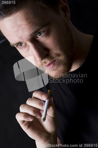 Image of man smoking a cigarette