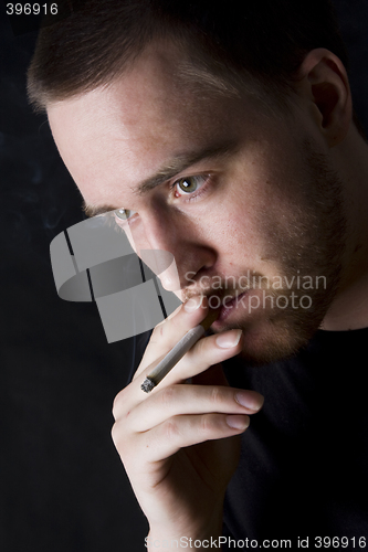 Image of man smoking a cigarette