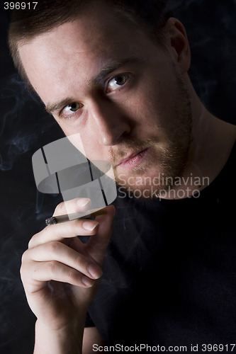Image of man smoking a cigarette