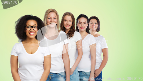 Image of group of happy different women in white t-shirts