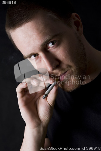 Image of man smoking a cigarette