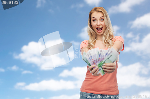 Image of happy young woman with euro cash money