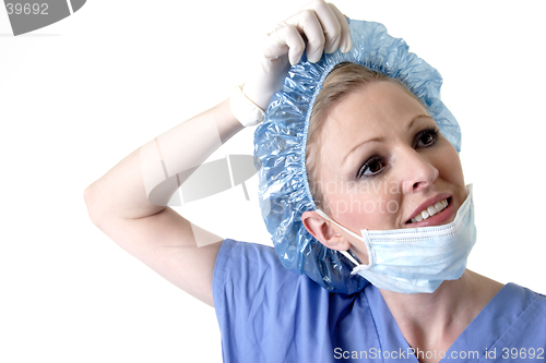 Image of Lady surgeon removing cap