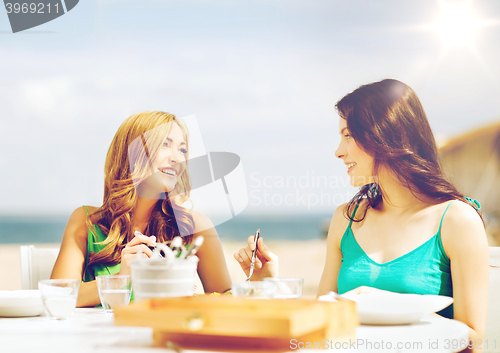 Image of girls in cafe on the beach