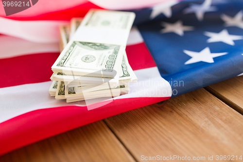 Image of close up of american flag and dollar cash money
