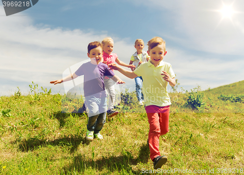 Image of group of happy kids running outdoors