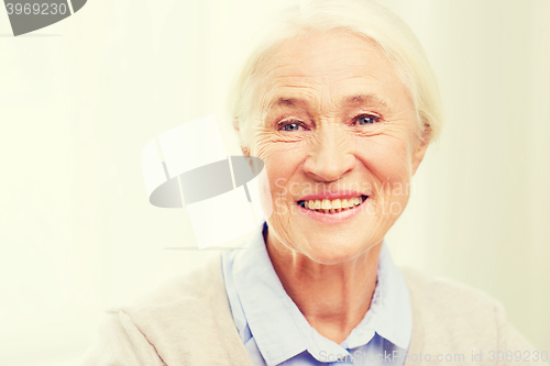 Image of happy senior woman face at home