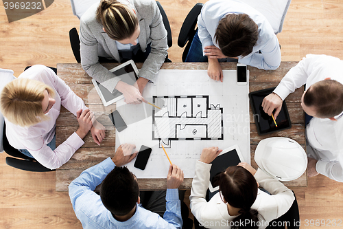 Image of close up of business team sitting at table