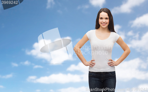 Image of smiling young woman in blank white t-shirt