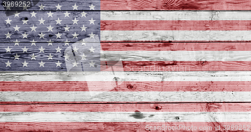 Image of american flag painted on wooden texture