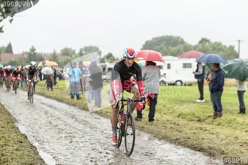 Image of The Cyclist Gatis Smukulis  on a Cobbled Road - Tour de France 2