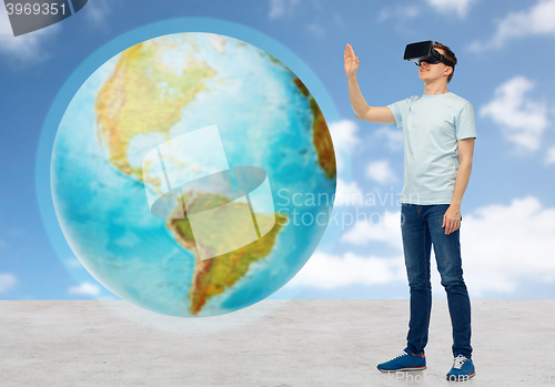 Image of happy man in virtual reality headset or 3d glasses