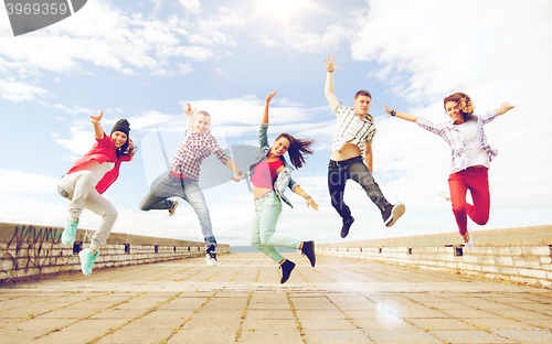 Image of group of teenagers jumping