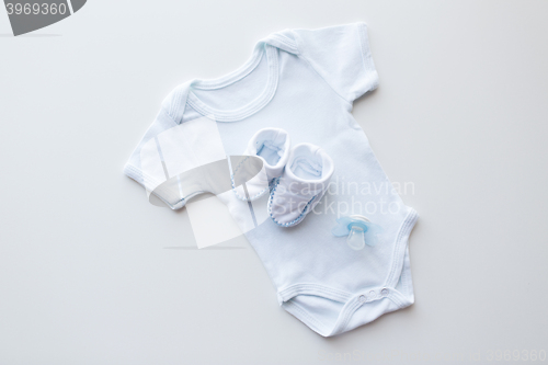 Image of close up of baby boys clothes for newborn on table