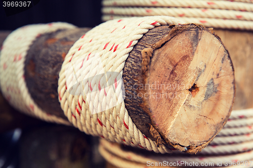 Image of wooden beam wrapped with rope