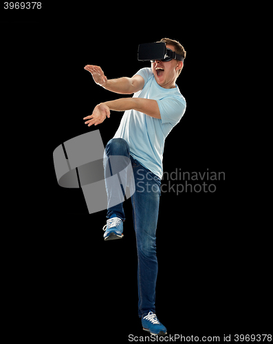 Image of happy man in virtual reality headset or 3d glasses