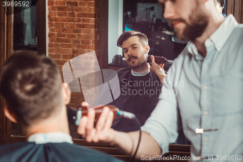 Image of Hipster client visiting barber shop