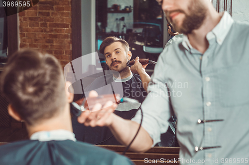 Image of Hipster client visiting barber shop