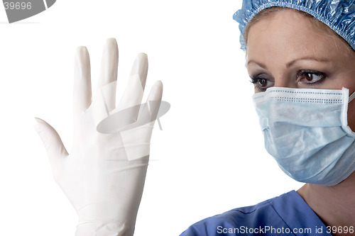 Image of Lady surgeon checking gloves