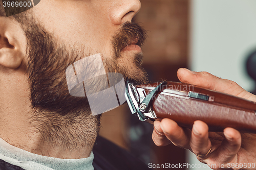 Image of Hipster client visiting barber shop