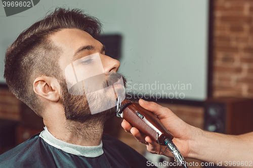 Image of Hipster client visiting barber shop