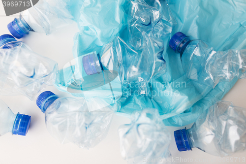 Image of close up of used plastic bottles and rubbish bag