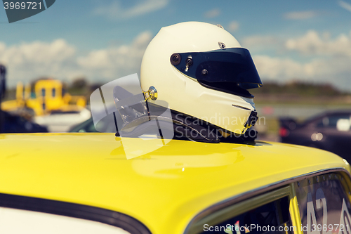 Image of close up of car with helmet on roof top