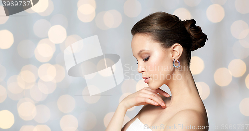 Image of close up of beautiful woman face with earring