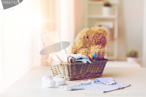 Image of close up of baby clothes and toys for newborn